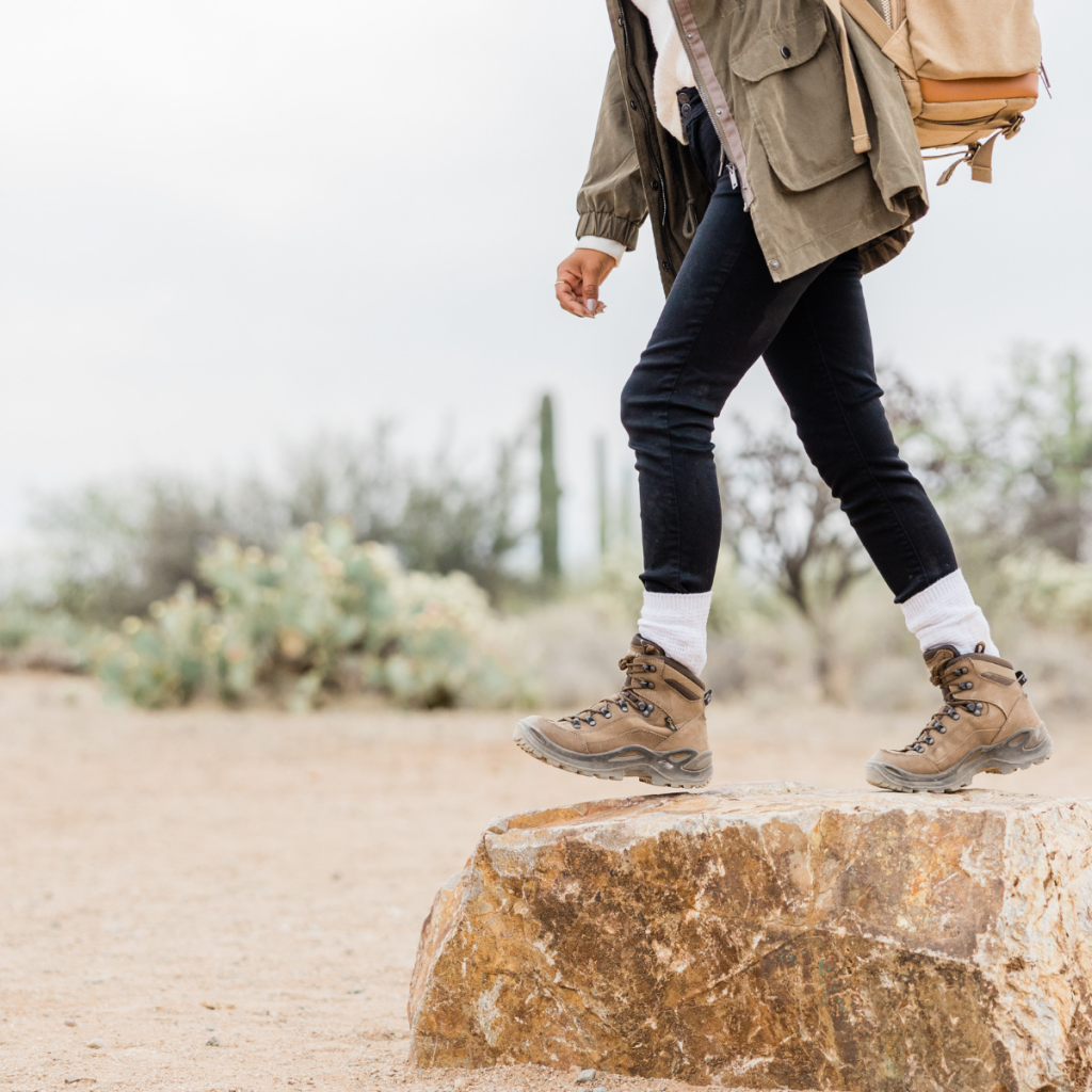 Girl hiking in Arizona desert nature to de-stress, reduce anxiety, and feel grounded.